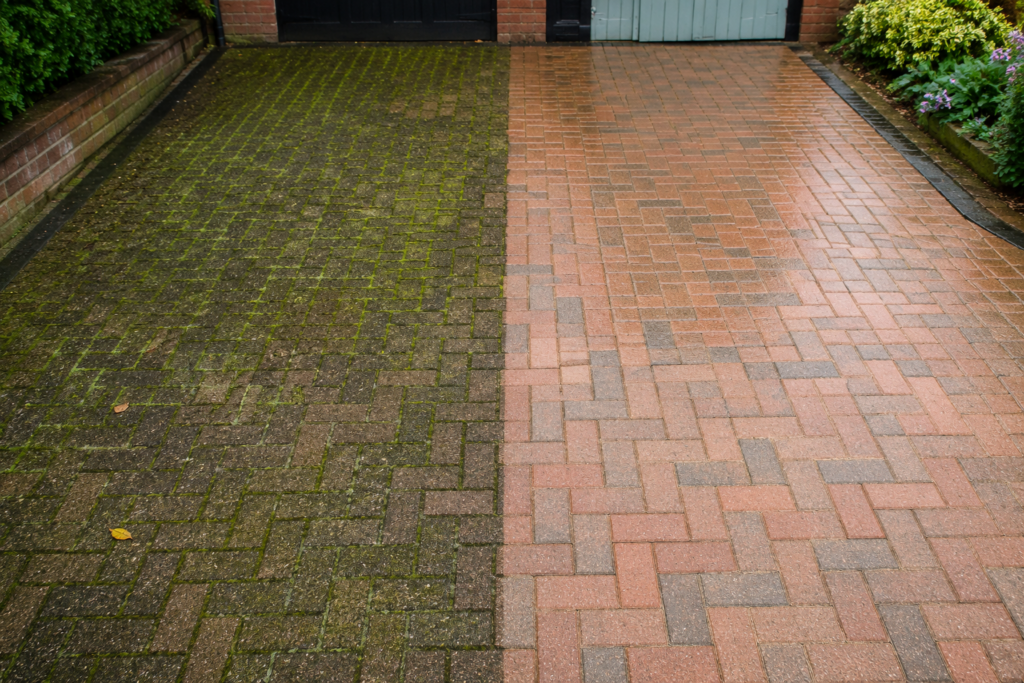 Before and after driveway cleaning showing heavy moss and algae removal from block paving driveway in Kent